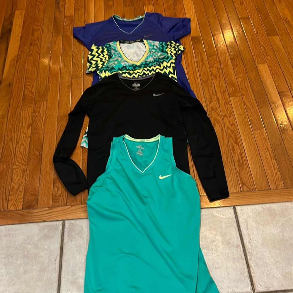 Women’s Nike spandex XL athletic tops. Total of four tops in the lot
